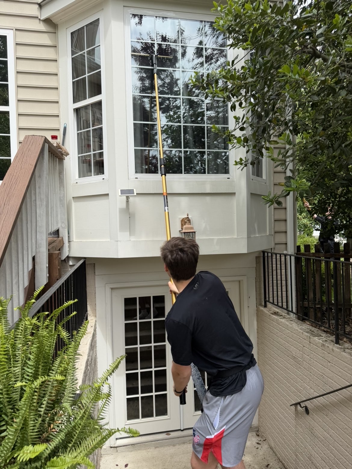 Blue Line Co. cleaning windows